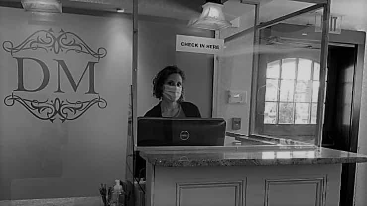 person behind counter at an office