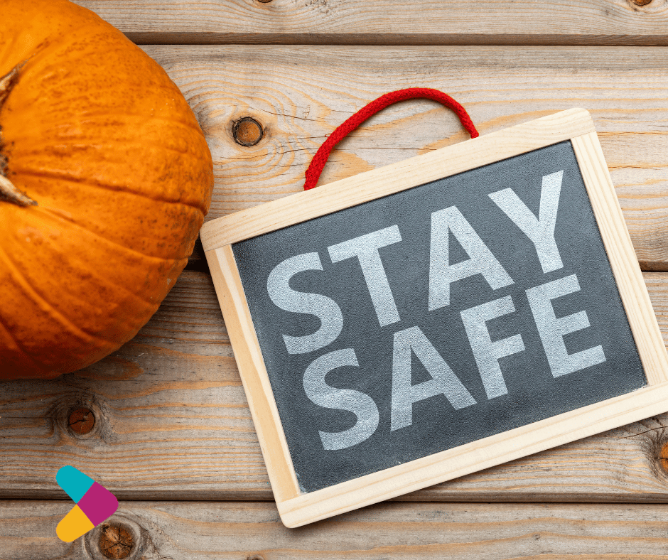 stay safe on sign near pumpkin