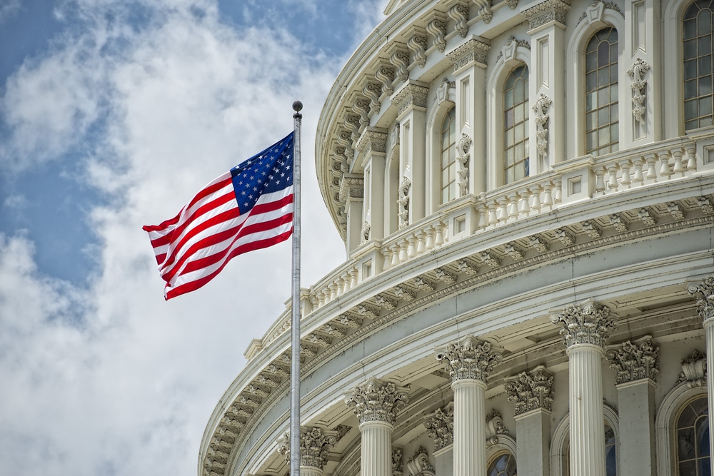 Washington,Dc,Capitol,Dome,Detail,With,Waving,American,Flag